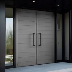 two double doors in front of a house