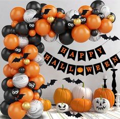 a halloween themed party with balloons and decorations