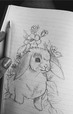 a drawing of a rabbit with flowers on its head