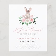 the bunny baby shower is shown with pink flowers and greenery on it's head