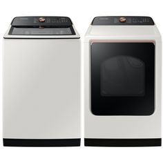 a white washer and dryer sitting side by side on top of each other