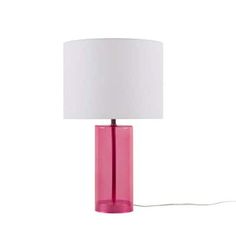 a pink glass table lamp with a white shade on the base and a cord attached to it