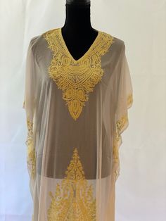 Embroidered Kashmiri Georgette Kaftan - One Size, Long. This Kaftan makes a perfect style statement for summer and your beach vacation. This is a bohemian style maxi dress that can be perfect as a swim coverup or for your beach vacations. caftans for women summer kaftan embroidered kaftan maxi gown loungewear Color: White with Yellow Embroidery Fits small to plus sizes. Measurements with room for comfort: Chest up to: 50 inches Length: 55 inches Care: Hand wash or dry clean only. Embroidered Kaftan For Beach Cover-up, Embroidered Long Kaftan For Beach, Long Embroidered Kaftan For Beach, Long Embroidered Beach Kaftan, Embroidered Short Sleeve Kaftan For Beach, Beach Kaftan With Embroidery And Short Sleeves, Intricately Embroidered Beach Kaftan For Spring, Spring Beach Kaftan With Intricate Embroidery, Elegant Embroidered Neckline Tunic For Summer