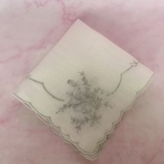 A beautiful, fancy vintage handkerchief with a detailed embroidery design featuring a stunning floral bouquets on each corner and scalloped trimmed edges. It is made of sheer white cotton. The silver tone under the white embroidery is the original embroidery guide often seen on this type of Appenzell and/or Swatow vintage embroidered linen. It measures 12" X 12". It is in good vintage condition with no tears, stains or other damage. Great for display among your boudoir collection. It also would Flower-shaped Embroidered Handkerchiefs For Gifts, Flower Shaped Embroidered Handkerchiefs For Gift, Embroidered Flower Handkerchiefs For Gifts, Embroidered Flower Handkerchiefs As Gift, Vintage Floral Embroidery Wedding Handkerchiefs, White Embroidered Flower Shaped Handkerchiefs, White Embroidered Flower-shaped Handkerchiefs, Traditional Floral Embroidered Handkerchiefs As Gift, Vintage Embroidered Handkerchiefs For Wedding