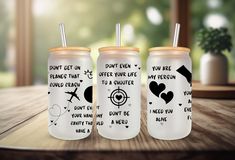 three personalized tumblers sitting on a table in front of a window with the words don't get over what makes you happy