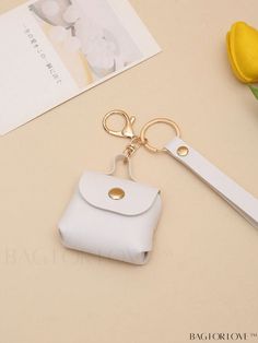 BagForLove - Sleek Keyring Bag Charm - Minimally Designed Product Description Color White Pattern Type Plain Material PU Details Pictures Similar Products h2 { text-align: center; } /* æ¢è¡ */ li{ white-space: normal; word-break: break-all; word-wrap: break-word; } .red-box { width: 100%; display: flex; flex-direction: row; flex-wrap: wrap; justify-content: center; } .red-box > div { width: 190px; height: 250px; margin: 10px; } .red-box > div > a > img { width: 190px; height: 250px; } .size-box { width: 100%; margin: auto; white-space: nowrap; } .table { border-collapse: collapse; border-spacing: 0; width: 100%; table-layout: fixed; } tr, td, th { border: 1px solid rgb(175, 173, 173); padding: 10px 0px; text-align: center; font-size: 14px; box-sizing: border-box; } .color-button { height Trendy White Bags For Personal Use, Minimalistic Style, Word Wrap, White Patterns, Bag Accessories, Color White, Sleek, Pattern, White