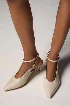 Leather upper, insole, sole Buckle styling Imported | Ankle-Wrap Kitten Heels by Anthropologie in Beige, Women's, Size: 8, Leather Summer Ankle Strap Court Shoes With Removable Insole, Beige Slingback Pumps With Wrapped Heel And Ankle Strap, Leather Ankle Strap Kitten Heels With Heel Loop, Summer Court Shoes With Heel And Ankle Strap, Summer Court Shoes With Heel Strap And Almond Toe, Summer Court Shoes With Ankle Strap, Chic Cream Kitten Heels With Round Toe, Beige Heels With Removable Insole And Single Toe Strap, Cream Ankle Strap Kitten Heels For Spring