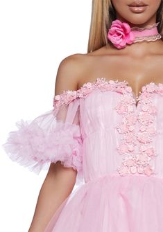 This mini dress has a tulle construction, an off the shoulder design with fabric lace and bow detailing, a ruffled trim, and a back zipper closure. Pink Mini Dress With Rose Detail For Evening, Pink Coquette Dress With Ruffles, Feminine Pink Mini Dress For Homecoming, Pink Coquette Evening Dress, Pink Ruffled Mini Dress For Prom, Tulle Mini Dress With Ruffles For Homecoming, Pink Evening Dress In A Flirty Style, Homecoming Tulle Mini Dress With Ruffles, Pink Off-shoulder Lace Dress