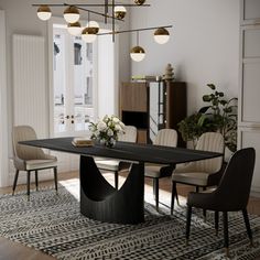 a dining room table and chairs in front of a fireplace with an area rug on the floor