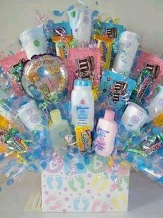 a baby shower gift basket filled with personal care products and confection items,