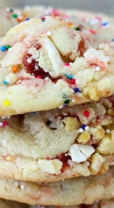 three cookies with sprinkles stacked on top of each other