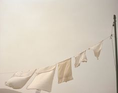 some white towels hanging on a clothes line