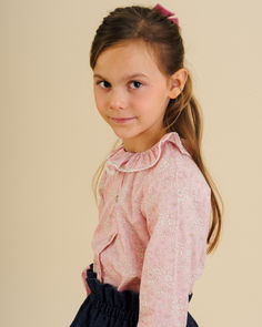 The Amelia Blouse is an understatedly exquisite addition to your little one's wardrobe. Crafted from Capel Pink Liberty fabric, this blouse exudes elegance with its ruffled collar, elasticated cuffs and front button fastening. Tops And Blouses, Girl Top, Childrens Clothes