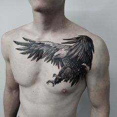 a man with an eagle tattoo on his chest