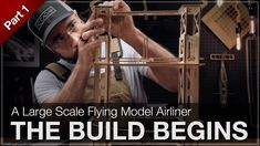 a man working on a wooden structure with the words, the big build begins