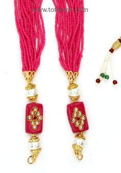 Magenta color layered seed Beads Dori - Tassel for Pendants 
  Length of the beads dori : 16.0 inches + adjustable upto 24 inches
  This item is NOT made of Gold
  This item does NOT have any Gold in it
  Use this dori - Tassel to attach it to pendants
  The dori - Tassels come with detachable hooks on each side, so it is very easy to clip it on to any pendant. 
  Add this to your favorite pendant to enhance its beauty. These will look awesome with our Temple Jewelry Pendants. 
  Buy these in va Black Dori Necklace Gold, Dori Tassels, Round Red Coral Single Strand Necklace, Coral Red Multi-strand Beaded Necklaces, Red Multi-strand Dangling Beads, Magenta Color, Temple Jewelry, Jewelry Pendants, Temple Jewellery