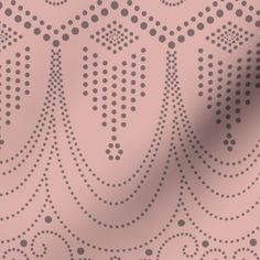 a pink background with black dots and circles on the surface, as well as an image of