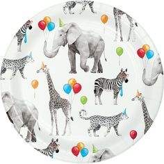 a paper plate with an elephant, giraffe and zebras pattern on it