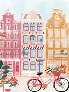 a pink bicycle with flowers in front of buildings