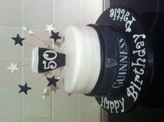 a birthday cake with the number 50 on top and stars around it for someone's 50th