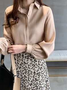 Made for the modern-day woman, this Elegant Gathered Sleeve Blouse will have you radiating some major classy vibes. Featuring a classic collar complete with a large button, covered front plaquette, and gathered sleeves, you’ll be looking graceful and refined from head to toe.This blouse pairs well with an array of bottoms including denims, solid leggings, or your favorite trousers to elevate your personal style. Female Blouse, Plaid Jacket Women, Plus Size Fall Fashion, Checkered Jacket, Lantern Sleeved Blouses, White Shirts Women, Shirts Women Fashion, Loose Shirt, Fashion Female