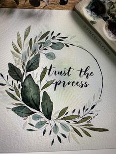 a watercolor painting with the words trust the process written in black ink on a white paper