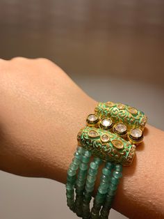 A signature piece that has a special place in every treasure box. Classic in its appeal, with a royal architecture, this bracelet is a timeless design. Size: Recommended for wrist size 2.6 to 2.8 Note: Its openable and easy to wear with hook closure. Royal Architecture, Wedding Jewellery Indian, Kundan Bracelet, Jewellery Kundan, Royal Green, Jewellery Indian, Bracelet Wedding, Indian Wedding Jewelry, Wedding Jewelry Bracelets