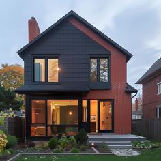 a large house with lots of windows in the front yard