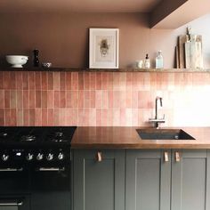 a kitchen with an oven, sink and counter top