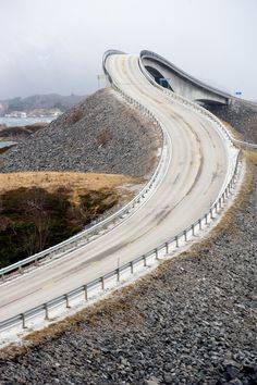 an image of a curved road going into the distance