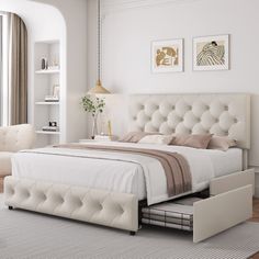 a bedroom with a white bed and beige furniture