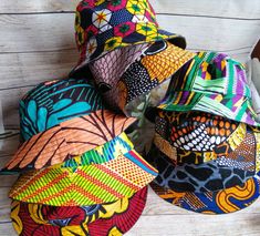 "Children's reversible bucket hat in bright African Ankara and kente prints and demin.  Sizes available: Small 18 1/2\" /48cms (1-2 yrs)  Medium 19 3/4\"/50cms (2-4 yrs)  Large 20 1/2\"/52cms (4-7 yrs)  Extra Large 21 1/4\"/54cms (7-12 yrs)  It is strongly advised to measure the child's head, as children's heads do vary in size.  If you require a larger/smaller size,please get in contact." Ankara Bucket Hats, Multicolor 5-panel Beach Hat, Reversible Multicolor Cotton Sun Hat, Multicolor Reversible Cotton Sun Hat, Reversible Multicolor Cotton Bucket Hat, Multicolor Reversible Cotton Bucket Hat, Multicolor Reversible Cap, Adjustable Multicolor Reversible Sun Hat, Adjustable Reversible Multicolor Bucket Hat