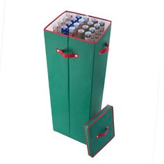 a large green case filled with lots of sodas and cans next to a suitcase