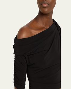 Jacquemus "Le Haut Drapeado" top featuring knotted neckline and shoulder details     Draped asymmetric boat neckline    Elbowlength gathered right sleeve    Cropped hem    Fitted silhouette    Slipover style    Viscose/nylon/polyamide/elastane    Dry clean    Made in Portugal Asymmetrical Ruched Fitted Blouse, Asymmetrical Ruched Top For Evening, Evening Draped One Shoulder Ruched Top, Ruched One-shoulder Top For Evening Wear, Asymmetric Top, Asymmetrical Tops, Boat Neckline, Fitted Silhouette, Bergdorf Goodman