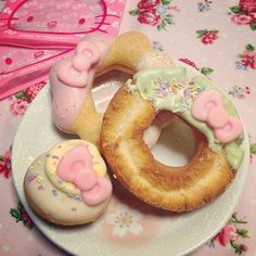 there are many donuts on the plate and one is shaped like a bunny rabbit