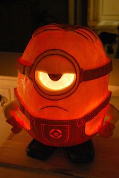 a close up of a pumpkin shaped like a minion