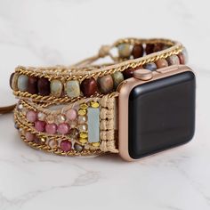 "Colorful Jasper Rhodonite Beaded Apple Watch Strap | Band 38mm 40mm 41mm 42mm 44mm 45mm | Compatible with all Apple Watch Series You will receive: ⭐️1 x Colorful Jasper Rhodonite Beaded Apple Watch Strap ⭐️Returns: Money back guarantee (30 days free returns) ⭐️About Shipping: Your order will be shipped via international Post and it usually takes 7-14 days to arrive iWatch strap is fully customizable  and is perfect for small wrists and big wrists!  🔹 Please message me for customized sizing 🔹 Rainbow jasper is called a \"sustaining stone,\" and thought to be helpful in times of emotional fatigue or stress. Used for its properties to both calm and sooth, it is believed to be beneficial in collecting one's thoughts so as to help one feel more secure and relaxed when making decisions. Rhodo Trendy Gold Beaded Watch Bands, Trendy Beaded Gold Apple Watch Band, Trendy Gold Beaded Apple Watch Band, Adjustable Beaded Brown Apple Watch Band, Adjustable Gold Beaded Watch Bands, Beaded Apple Watch Band Gift, Boho Chic Bracelets, Bohemian Bracelets, Apple Watch Strap