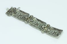 Art Deco Costume Jewelry Bracelet Impressive and one of a kind vintage rare wide Art Deco silver paste bracelet. Highly collectible, example of Art Deco costume jewelry. Approximate Measurements: Length 7.2", Width 1.4" Silver Rectangular Diamond Bracelet With 17 Jewels, Silver Diamond Bracelet With 17 Jewels, Art Deco Silver Diamond Bracelet Gift, Art Deco Silver Diamond Bracelet As A Gift, Silver Art Deco Diamond Bracelet As Gift, Art Deco Silver Jubilee Bracelet, Vintage Silver Diamond Bracelet With 17 Jewels, Wide Art, Facebook Art