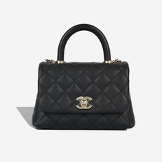 The Mini Coco Handle comes with practicality and style and is the smallest size in this collection. This bag comes with the Chanel classic flap and twist lock system. Designed for hand held use or for wearing over your shoulder with the very convenient removable strap. This Chanel may be a mini, but it comes with two compartments and includes two extra pockets. Chic and sweet, this Chanel is a delightful edition to the flap collection. SPL Exterior Black caviar leather Chanel twist lock fastening Champagne-gold toned hardware Top handle Removable should strap - chain / leather Metal feet at the base Slip pocket at the back 2020 Production Unused condition - protective seal on CC Interior Burgundy leather lining Two compartments divided in the centre One zip compartment Brand new condition Chanel Mini Top Handle, Chanel Coco Handle Mini, Chanel Small Flap Bag With Top Handle, Chanel Mini Handle Pink, Pink Caviar Vanity Chanel Bag, Chanel Coco Handle, Coco Handle, Black Caviar, Leather Chain