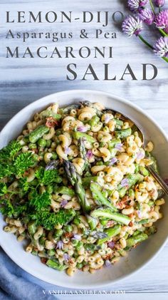 lemon - dijo asparagus and pea macaroni salad in a white bowl