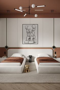 two beds in a room with white walls and wooden floors, one has a teddy bear on the floor