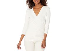 LAUREN Ralph Lauren Wrap-Style Jersey Top - Women's Clothing : Mascarpone Cream : Figure-flattering ruching elevates the romantic appeal of the LAUREN Ralph Lauren Wrap-Style Jersey Top which features a faux-wrap, and embroidered with Lauren's monogram for a signature finish. Long sleeve V-neck with a straight hemline an a slim fit. Intended to hit at the hip. 95% viscose, 5% elastane. Machine washable. Imported. Measurements: Length: 24 in Sleeve Length: 20 in Product measurements were taken us Elegant Faux Wrap Tops For Spring, Spring Formal Ruched Top, Formal Ruched Top For Spring, Ruched Formal Top For Spring, Elegant Fitted Tops With Surplice Neckline, Elegant Fitted Top With Surplice Neckline, Mascarpone Cream, Jersey Top, Beach Club