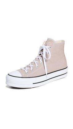 PRICES MAY VARY. Rubber sole Lightly cushioned lining and padded insole Platform: 1.5in / 35mm Platform profile Round toe A classic pair of high-top Converse Chuck Taylor sneakers, updated with a mid-height platform for a little extra lift. Light Pink Platform Converse, Beige Platform Converse, Beige Converse, Converse Platform, Forest Core, Pink Platforms, Converse Run Star