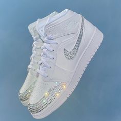 Shown: Jordan 1 Mids - Crystal Swooshes - Crystal Filled Toe Caps - Printed Name & Date Personalization Choose between Air Force 1s, Jordan 1s, and Dunk Lows. Select ANY crystal color from our color chart. The diamond color shown is named 'Crystal 001' & type 'Pearls' in the personalization box for pearl swooshes only. You will need to know your US Nike shoe size - https://www.nike.com/size-fit/unisex-footwear-mens-based Conversion Example: 6 Youth/Mens = 7.5 Women's Want to see Dunks & Jordans options? They are waiting for you in my shop! Crystal Lettering Upgrade available for an additional $60. Message us to inquire. NEED IT FAST? Get your order prioritized and delivery date guaranteed, click this link to add "Rush Processing" to your cart. https://www.leilabcrystals.com/listing/1102012 Tennis Shoes For Quinceanera, Bedazzled Jordans, Wedding Jordans, Prom Sneakers, Custom Air Jordan 1, Air Jordan 1 Mid White, Jordan 1 Mid White, White Bridal Shoes, Crystal Colors