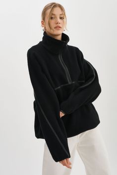 Perfect for weekends on the go, the HELSA half-zip pullover takes the athleisure aesthetic to tasteful new heights. The texture of the fluffy polar fleece is contrasted with faux-leather piping throughout, producing a closet must-have for tackling cold weather this season. Sherpa Fleece, Cozy Fit Fleece Sweater In Black, Cozy Black Sweatshirt With Fleece Lining, Cozy Black Fleece Top, Black Fleece-lined Top For Winter, Black Half-zip Fleece Jacket For Streetwear, Perfect White Tee, Leather Outerwear, Cardigan Sweater Dress