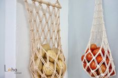 there are two hammocks hanging on the wall with tomatoes and potatoes in them