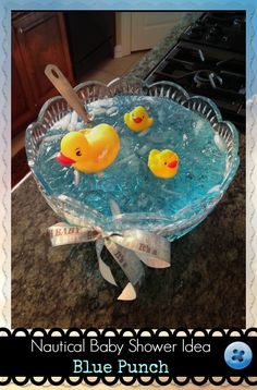 two rubber ducks in a glass bowl on a counter