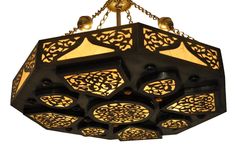 a chandelier hanging from a chain with several lights on each end and an intricate design