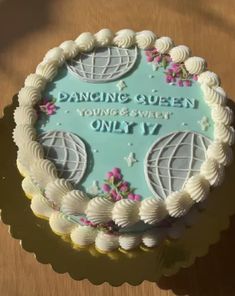 a cake that is sitting on top of a table with the words dancing queen young and sweet only 17