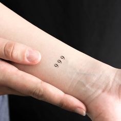 a person with a small tattoo on their left arm that says,'go '